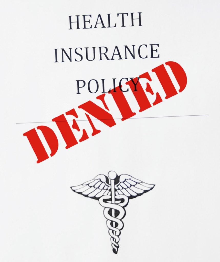 Virallista asiakirjan kansilehteä muistuttava kuva, jossa lukee "Health insurance policy", jonka päälle leimattu "DENIED"
